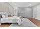 Bright bedroom with plush bed, area rug, and custom built-in wardrobe cabinets with drawers at 8336 Boyla Ct, Windermere, FL 34786
