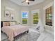 Bright bedroom with natural light, complete with a playful teepee and comfortable rug at 8336 Boyla Ct, Windermere, FL 34786