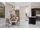 Dining area connected to the living room and kitchen with stylish seating and elegant decor at 8336 Boyla Ct, Windermere, FL 34786