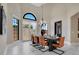 Bright dining room with a contemporary black dining table with leather chairs, chandelier and lots of windows at 8336 Boyla Ct, Windermere, FL 34786