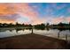 Waterfront property featuring a private dock with boat lift access, offering serene lake views and recreational opportunities at 8336 Boyla Ct, Windermere, FL 34786