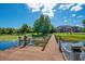 A private boat dock on a waterfront property featuring a lift, providing exclusive lake access and recreational activities at 8336 Boyla Ct, Windermere, FL 34786