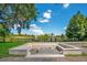 Fire pit area with pavers and a view of the lake at 8336 Boyla Ct, Windermere, FL 34786