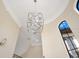 Grand foyer featuring a modern chandelier and high ceilings at 8336 Boyla Ct, Windermere, FL 34786