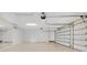 Well-lit garage featuring an automatic door opener, a large mirror and generous space for multiple vehicles and storage at 8336 Boyla Ct, Windermere, FL 34786
