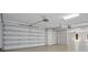Spacious garage with automatic door openers, overhead lighting, and ample room for vehicles and storage at 8336 Boyla Ct, Windermere, FL 34786