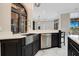The kitchen features modern stainless-steel appliances, dark cabinets, quartz counters, and a marble floor at 8336 Boyla Ct, Windermere, FL 34786