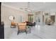 Open-concept living room with stylish furniture, modern lighting, and a view of the outdoor space at 8336 Boyla Ct, Windermere, FL 34786