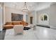 Bright and spacious living room with marble floors, a fireplace, and stylish modern furniture at 8336 Boyla Ct, Windermere, FL 34786