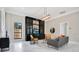 Comfortable living room with built-in shelves, stylish furniture, and a large window providing natural light at 8336 Boyla Ct, Windermere, FL 34786