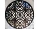 Artistic window with an ornate circular wood design that allows light to subtly filter through into the room at 8336 Boyla Ct, Windermere, FL 34786