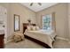 Bedroom with neutral walls and decor, soft carpet, a comfortable bed and natural light at 9318 Lake Hickory Nut Dr, Winter Garden, FL 34787