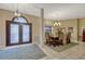Formal dining room adjacent to the entryway features stylish decor and comfortable seating at 9318 Lake Hickory Nut Dr, Winter Garden, FL 34787