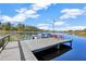 Dock with a boat and seating on a sunny day at 9318 Lake Hickory Nut Dr, Winter Garden, FL 34787