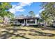 Well-maintained home featuring large windows and a spacious backyard at 9318 Lake Hickory Nut Dr, Winter Garden, FL 34787