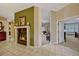 Elegant living room with a marble fireplace, open layout, and tile flooring leading to a bedroom and second living area at 9318 Lake Hickory Nut Dr, Winter Garden, FL 34787
