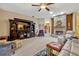 Inviting living room features a cozy fireplace, large entertainment center, and comfortable seating at 9318 Lake Hickory Nut Dr, Winter Garden, FL 34787