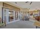 Relaxing screened patio features large windows, comfortable furniture, and views of the backyard at 9318 Lake Hickory Nut Dr, Winter Garden, FL 34787