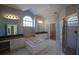 Luxurious bathroom featuring a large soaking tub, and walk-in shower at 9833 Camberley Cir, Orlando, FL 32836