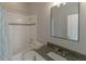 Bright bathroom with a shower-tub combo, granite countertop vanity, and neutral-toned walls, offering a clean aesthetic at 9833 Camberley Cir, Orlando, FL 32836
