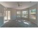 Spacious bedroom with neutral carpet, built-in cabinets, and a view of the pool at 9833 Camberley Cir, Orlando, FL 32836