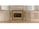 Elegant fireplace with stone surround and built-in shelving and cabinets at 9833 Camberley Cir, Orlando, FL 32836