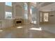 Bright living room features travertine floors, fireplace, built-in shelving, and french doors with pool views at 9833 Camberley Cir, Orlando, FL 32836