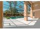 Inviting screened-in pool area featuring lush landscaping, and large deck for entertaining at 9833 Camberley Cir, Orlando, FL 32836