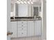 Bathroom featuring a double sink vanity with granite countertop and a large mirror with modern lighting at 995 Casa Del Sol Cir, Altamonte Springs, FL 32714