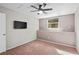 Comfortable bedroom with neutral walls, carpeted floor, a ceiling fan, and a window that provides natural light at 995 Casa Del Sol Cir, Altamonte Springs, FL 32714