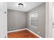 This bedroom features hardwood floors, neutral walls, a window with mini blinds, and a built-in closet at 995 Casa Del Sol Cir, Altamonte Springs, FL 32714