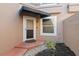 Charming front entrance with a covered entry, manicured landscaping, and classic door design at 995 Casa Del Sol Cir, Altamonte Springs, FL 32714