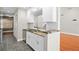 Modern kitchen featuring granite countertops, white cabinets, and stainless steel appliances at 995 Casa Del Sol Cir, Altamonte Springs, FL 32714