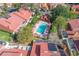 Aerial view of a community pool with lounge chairs and shade under the small building next to the pool at 995 Casa Del Sol Cir, Altamonte Springs, FL 32714