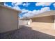 Paver backyard features fenced patio and a glimpse of blue sky and clouds at 9951 Alliteration Aly, Winter Garden, FL 34787