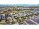 An aerial view of the neighborhood showcases the well-maintained landscaping and the community playground and amenities at 1003 Jack Nicklaus Ct, Kissimmee, FL 34747
