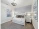 Bedroom featuring a bunk bed with decorative wallpaper accent, overhead decorative lighting, and carpet at 1003 Jack Nicklaus Ct, Kissimmee, FL 34747