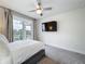 Bedroom with a ceiling fan, balcony access, and mounted television at 1003 Jack Nicklaus Ct, Kissimmee, FL 34747
