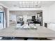 Spacious dining room with modern chandelier offering a view of the open layout including the kitchen and living room at 1003 Jack Nicklaus Ct, Kissimmee, FL 34747