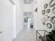 Bright hallway features high ceilings, white walls, decor, and tiled floors providing a welcoming and open feel at 1003 Jack Nicklaus Ct, Kissimmee, FL 34747