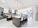 Modern kitchen with a large island, pendant lights, and bar stool seating providing a stylish and functional space at 1003 Jack Nicklaus Ct, Kissimmee, FL 34747