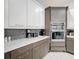 Elegant kitchen boasts stainless steel appliances, stylish backsplash, and ample countertop space, great for cooking at 1003 Jack Nicklaus Ct, Kissimmee, FL 34747