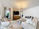 Comfortable living area with ample seating, a decorative rug, and stylish accents at 1003 Jack Nicklaus Ct, Kissimmee, FL 34747