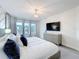 Bright primary bedroom with ample natural light, chandelier, and decorative furniture at 1003 Jack Nicklaus Ct, Kissimmee, FL 34747
