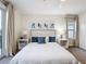 Cozy main bedroom with light walls, neutral carpet, and large windows dressed with light-filtering curtains at 1003 Jack Nicklaus Ct, Kissimmee, FL 34747