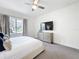 Minimalist main bedroom featuring ample natural light and a spacious layout at 1003 Jack Nicklaus Ct, Kissimmee, FL 34747