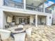 An exterior patio featuring a built in kitchen, fire pit and patio furniture at 1003 Jack Nicklaus Ct, Kissimmee, FL 34747
