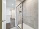 Beautifully tiled shower with glass doors and an in-set shelf at 1003 Jack Nicklaus Ct, Kissimmee, FL 34747