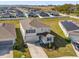Aerial view of a well-maintained residence featuring manicured landscaping and surrounding neighborhood at 1209 Mattie Pointe Blvd, Auburndale, FL 33823