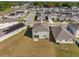 Aerial view of home showcasing its backyard, landscaping, and proximity to neighborhood amenities at 1209 Mattie Pointe Blvd, Auburndale, FL 33823